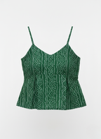 Green printed peplum tunic top.